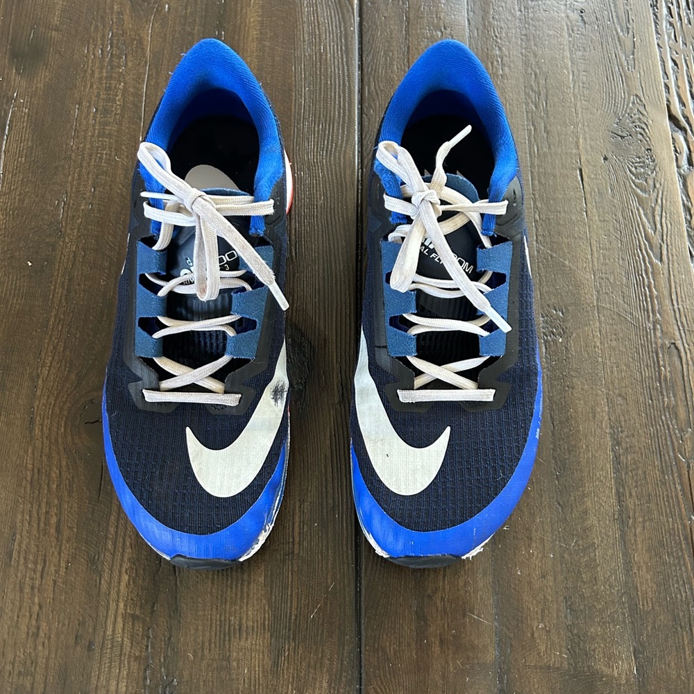 Men’s Nike Rival Fly 3 shoes, size 8. Blue/ opsidian with orange accent.